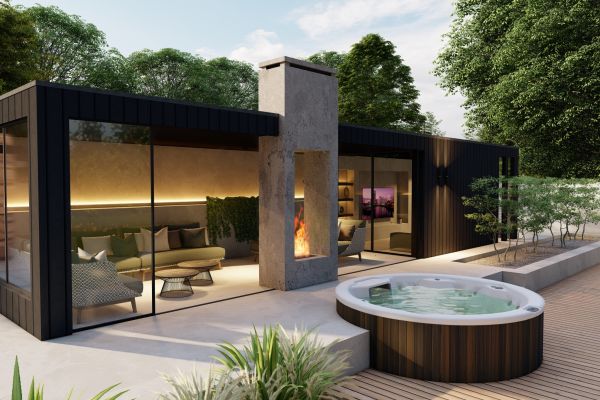 Rond spa bad zwart hout in verhoogd terras bij exclusief buitenverblijf